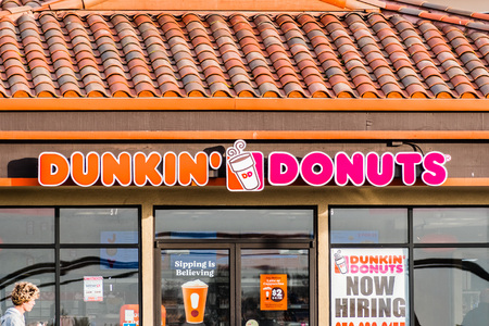 December 17, 2018 Half Moon Bay / CA / USA - Dunkin' Donuts sign above the entrance to the location in Half Moon Bayのeditorial素材