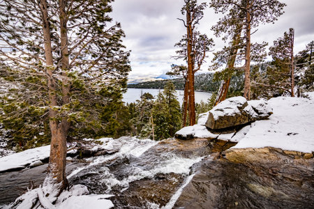 Lower Eagle falls on a cloudy winter day, Emerald bay and Lake Tahoe visible in the backgroundの写真素材