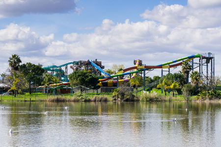 Water slide on the shoreline of a pond, Cunningham Lake, San Jose, south San Francisco bay, Californiaのeditorial素材