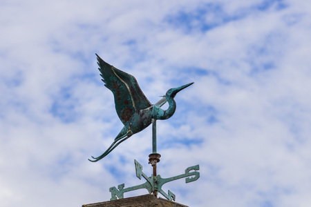 Old weather vane on a cloudy sky background, Californiaの写真素材