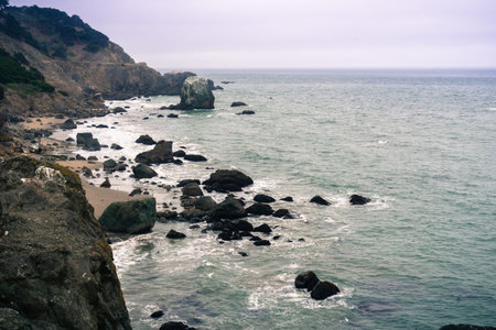 Rugged coastline on a foggy day, Lands End, San Francisco, California