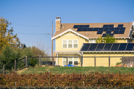 Solar panels on the rooftop of residential buildings; vineyards in the foreground; Livermore, east San Francisco bay, Californiaのeditorial素材