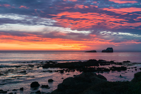 Dramatic sunset on the Pacific Ocean coastline near San Simeon, California