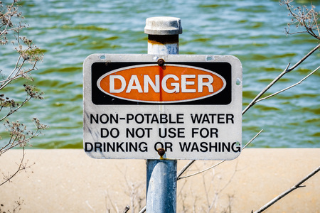 "Danger Non-potable water" sign posted on the shorelines of south San Francisco bay area, Californiaの写真素材