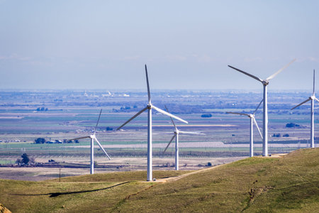 Wind turbines on the hills of east San Francisco bay, Stockton valley in the background, Alameda...