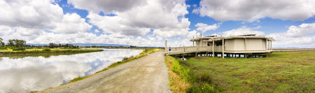 Walking path in Palo Alto Baylands Park, the Nature education center on the right