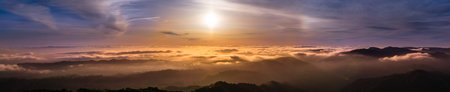 Panoramic view of a sunset over a sea of clouds covering south San Francisco bay area; beautiful...