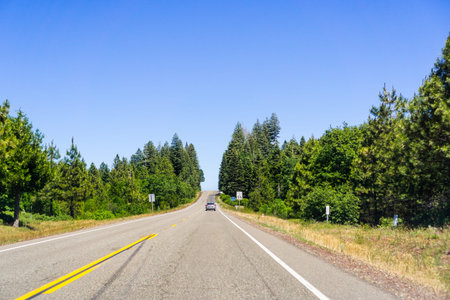 Driving on the highway between Redding and Burney on a sunny summer day, Shasta County, Northern...