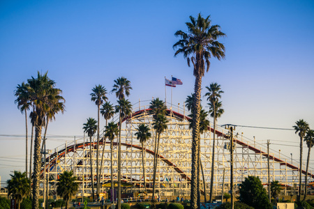 July 8, 2017 Santa Cruz/CA/USA - The Giant Dipper Roller coaster in Santa Cruz Beach Boardwalk amusement park at sunset, Californiaのeditorial素材