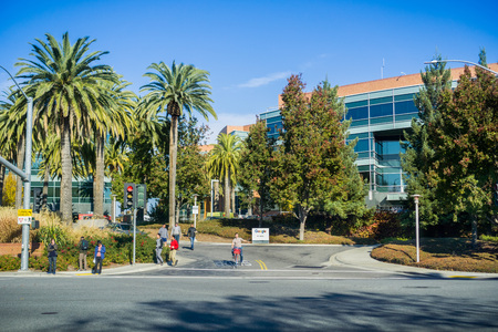 December 13, 2017 Mountain View / CA / USA - Google office buildings located in the campus situated in Silicon Valley; employees waiting to cross the streetのeditorial素材