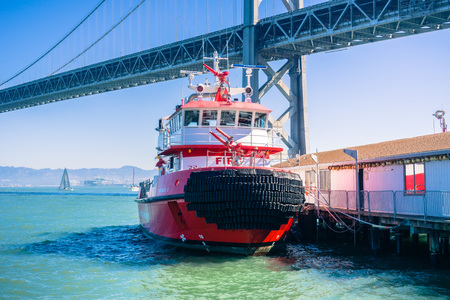 October 7, 2017 San Francisco/CA/USA - Firefighter boat anchored near the Bay bridgeのeditorial素材