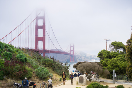August 10, 2017 San Francisco/CA/USA - Tourists gather close to The Golden Gate Bridge Welcoming Center on a foggy dayのeditorial素材