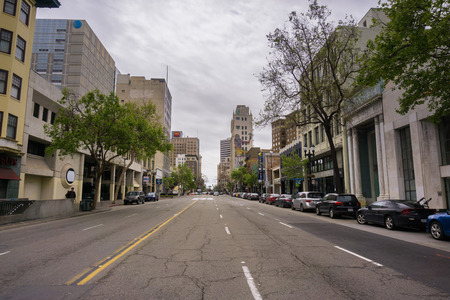 March 26, 2017 Oakland/CA/USA - Street in downtown Oakland and the Cathedral building on an overcast dayのeditorial素材