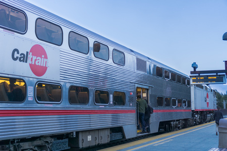 January 25, 2018 Mountain View / CA / USA - Commuters taking the evening Caltrain; Train about to leave the station; San Francisco bay areaのeditorial素材