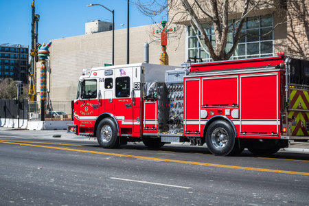 February 21, 2018 San Jose / CA / USA - Firetruck rushing down a street in downtown San Jose, south...
