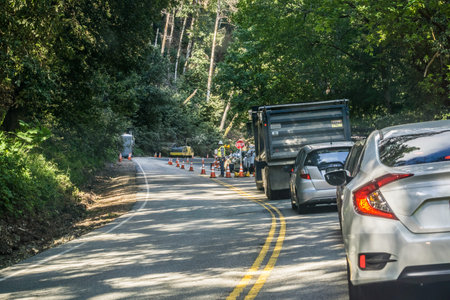 May 12, 2017 Saratoga/CA/USA - Cars waiting to pass through a construction area located on a winding...