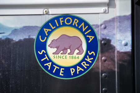 December 23, 2017 San Simeon / CA / USA - California State Parks logo on a tour bus door at Hearst Castleのeditorial素材