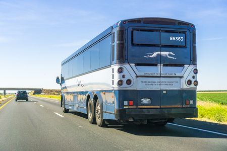 June 10, 2018 Los Banos / CA / USA - Greyhound bus driving north on I5 interstate towards San Franciscoのeditorial素材
