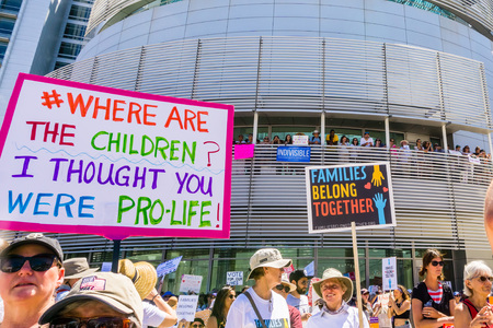 June 30, 2018 San Jose / CA / USA - Banner raised at the "Families belong together" rally held in front of the City Hall, in downtown San Jose, a sanctuary city in south San Francisco bay areaのeditorial素材
