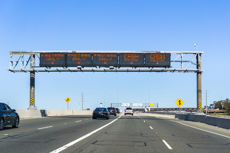 June 23, 2018 Martinez / CA / USA - Traffic lanes designation information (Fastrak or / and Cash) before the toll plaza for the Benicia Martinez Bridge; north San Francisco bay areaのeditorial素材