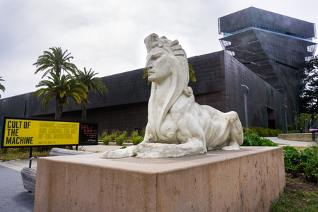 May 6, 2018 San Francisco / CA / USA - Sphinx Statue by Arthur Putnam located in front of De Young Museum in Golden Gate Park; Temporary exhibition banner "Cult of the Machine" visible on the leftのeditorial素材