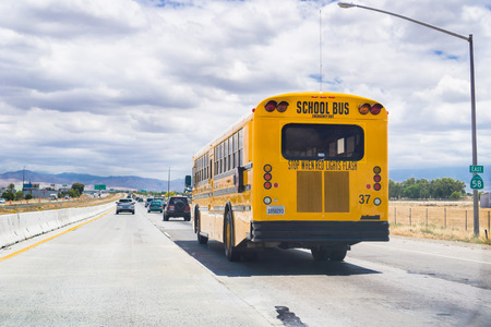 May 25, 2018 Bakersfield / CA / USA - School Bus travelling on the highwayのeditorial素材