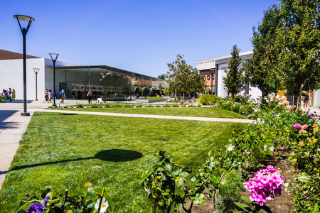 August 2, 2018 Palo Alto / CA / USA - Beautiful landscaping at the upscale, open air Stanford shopping center; the Apple and Macy's stores visible in the background; San Francisco bay areaのeditorial素材