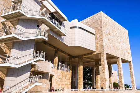 June 8, 2018 Los Angeles / CA / USA - One of the facades of the Museum Exhibitions Pavilion at the Getty Center where walls tiled with travertine rock meets an aluminium staircase;のeditorial素材