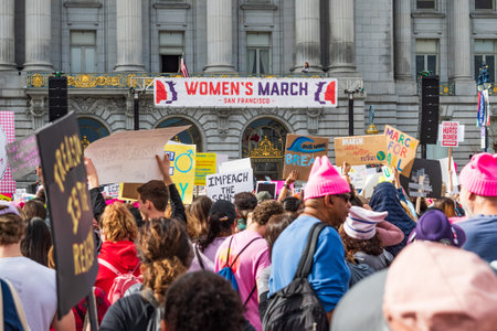 January 19, 2019 San Francisco / CA / USA - Participants to the Women's March event hold signs with...