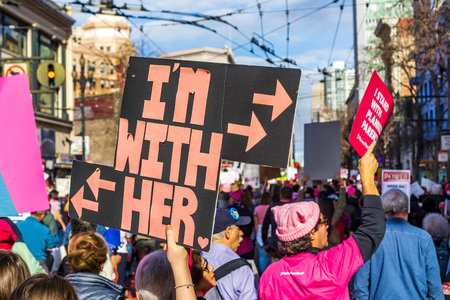January 19, 2019 San Francisco / CA / USA - Participant to the Women's March event holds "I'm with Her" sign while marching on Market street in downtown San Franciscoのeditorial素材
