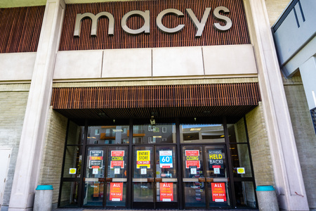 February 28, 2019 Sunnyvale / CA / USA - Exterior view of a Macy's store about to close; signs advertising high discounts placed on the entrance doorsのeditorial素材