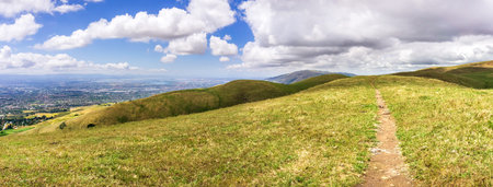 Hiking trail through the hills of south San Francisco bay area (visible in the background), San...