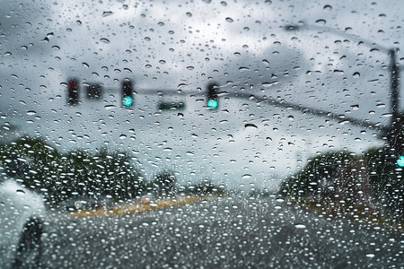 Driving on a rainy day; raindrops on the windshield; San Jose, Californiaの写真素材