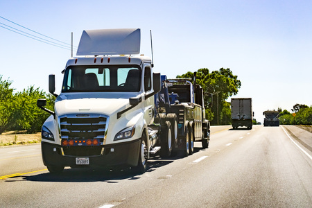 June 26, 2019 Tracy / CA / USA - Truck towing another truckのeditorial素材