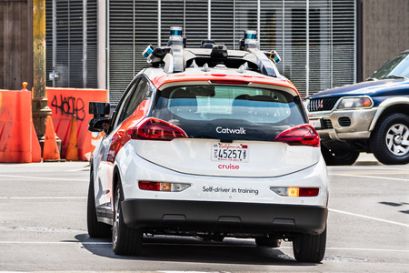 August 10, 2019 San Francisco / CA / USA - Cruise (owned by General Motors) self driving vehicle performing tests on the city streets; The company is using re-branded Chevrolet Bolt vehiclesのeditorial素材