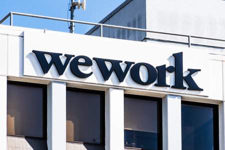 Oct 18, 2019 Berkeley / CA / USA - Close up of WeWork sign displayed on the building offering...