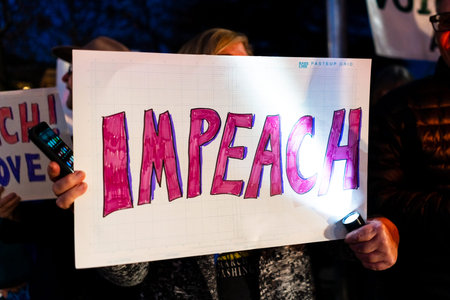Dec 17, 2019 Mountain View / CA / USA - Impeach sign raised at the Impeachment Eve Vigil rally held...