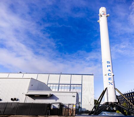 Dec 8, 2019 Hawthorne / Los Angeles / CA / USA - SpaceX (Space Exploration Technologies Corp.) headquarters; Falcon 9 rocket displayed in the front; SpaceX is a private American aerospace manufacturerのeditorial素材