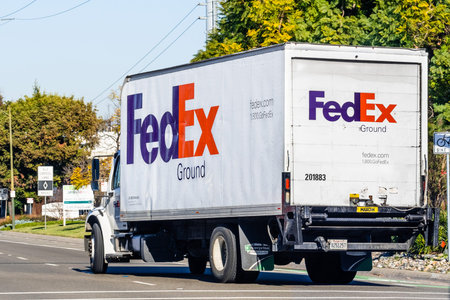 Feb 7, 2020 San Jose / CA / USA - FedEx truck making deliveries in South San Francisco Bay Area