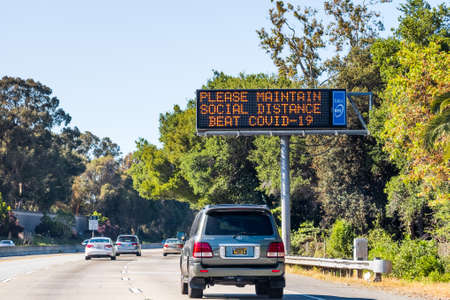 May 24, 2020 Sunnyvale / CA / USA - COVID-19 related message asking for people to maintain social distance, displayed on a digital sign on a freeway in South San Francisco Bay Areaのeditorial素材