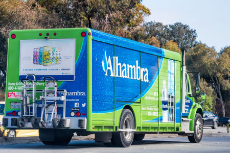 May 28, 2020 Redwood City / CA / USA - Close up of Alhambra water delivery service truck driving on...