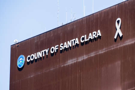May 20, 2020 San Jose / CA / USA - County of Santa Clara sign on the facade of a building housing some of its agencies and servicesのeditorial素材