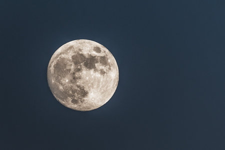 Close up of full moon; dark background