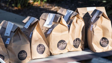 July 12, 2020 Sunnyvale / CA / USA - Brown bags with fresh groceries ordered online through Amazon Prime from Whole Foods Market and home delivered during the COVID-19 Shelter in Place orderのeditorial素材