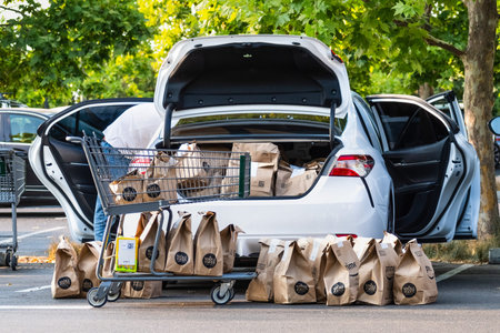 August 1, 2020 Cupertino / CA / USA - Vehicle loaded by an Amazon Prime delivery person with...