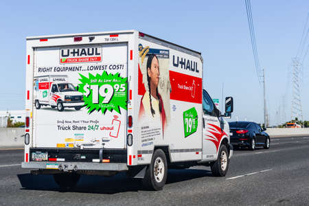 September 23, 2020 Fremont / CA / USA - U-Haul van travelling on the freeway; U-Haul is an American company offering DIY moving solutionsのeditorial素材