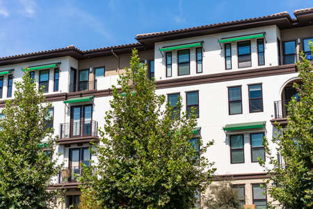 Exterior view of modern apartment building offering luxury rental units in Silicon Valley; Sunnyvale, San Francisco bay area, Californiaの写真素材