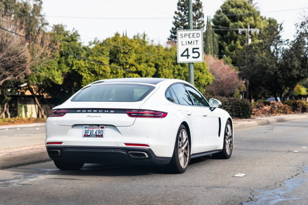 Jan 1, 2021 Concord / CA / USA - Porsche Panamera vehicle driving on a city street; The Porsche Panamera is a mid/full-sized luxury vehicle manufactured by the German automobile manufacturer Porscheのeditorial素材