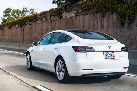Oct 10, 2020 Fremont / CA / USA - Tesla Model 3 travelling on the freeway in Silicon Valley; East San Francisco bay areaのeditorial素材