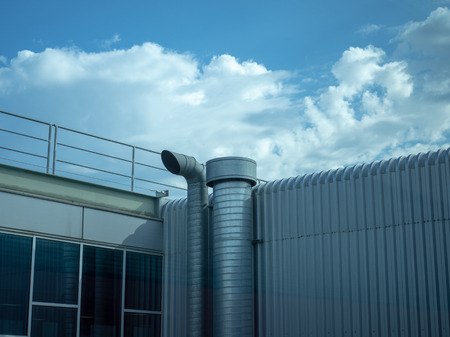 Industrial air vent chimney with sky backgroundの写真素材